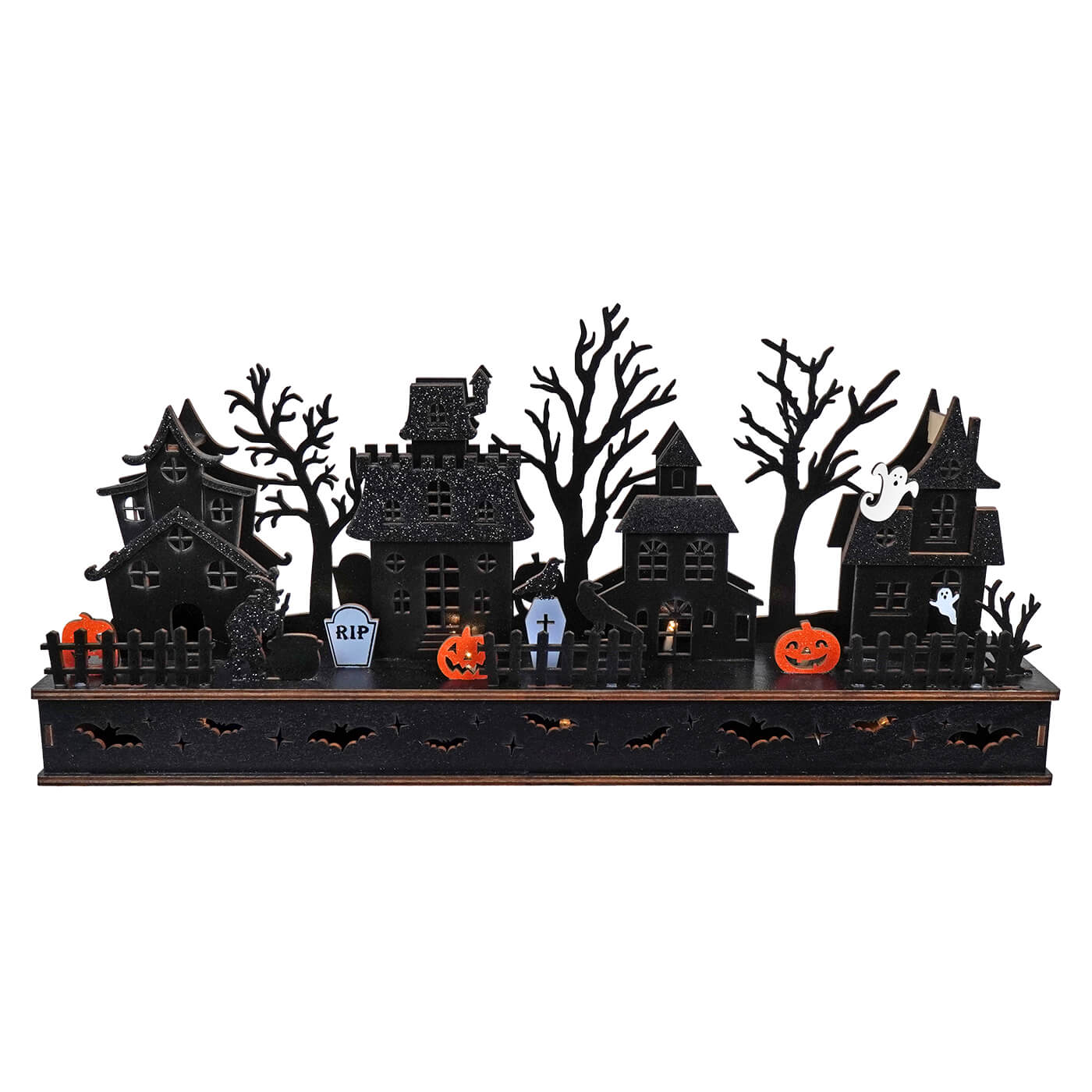 Halloween-themed decorative display featuring silhouettes of spooky houses, trees, and holiday icons.