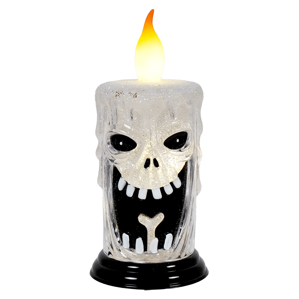 Spooky skull-shaped candle with an electronic flame on top.