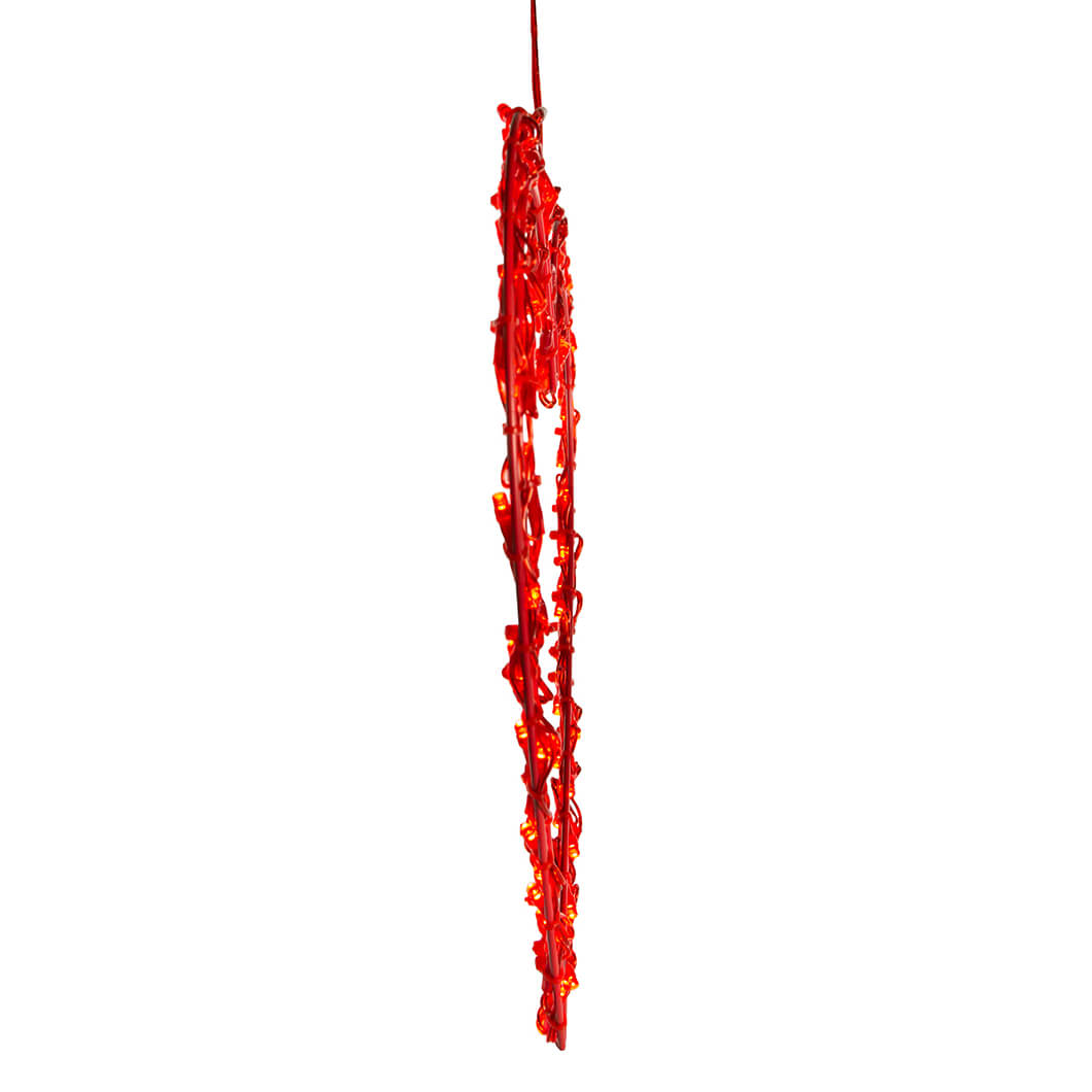 Long, thin strand of bright red material with a jagged, irregular texture hanging vertically.