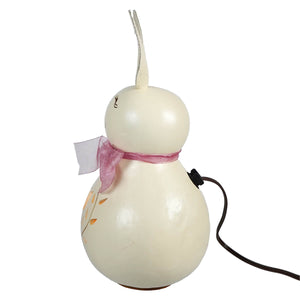 Cream-colored white poppy bunny gourd lamp with pink ribbon bow and decorative tulip and vines cutout from meadowbrooke gourds