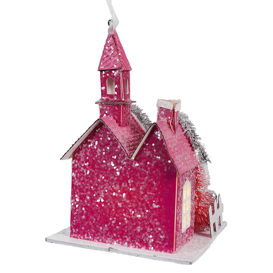 Pink glittery Christmas ornament in the shape of a church or chapel.