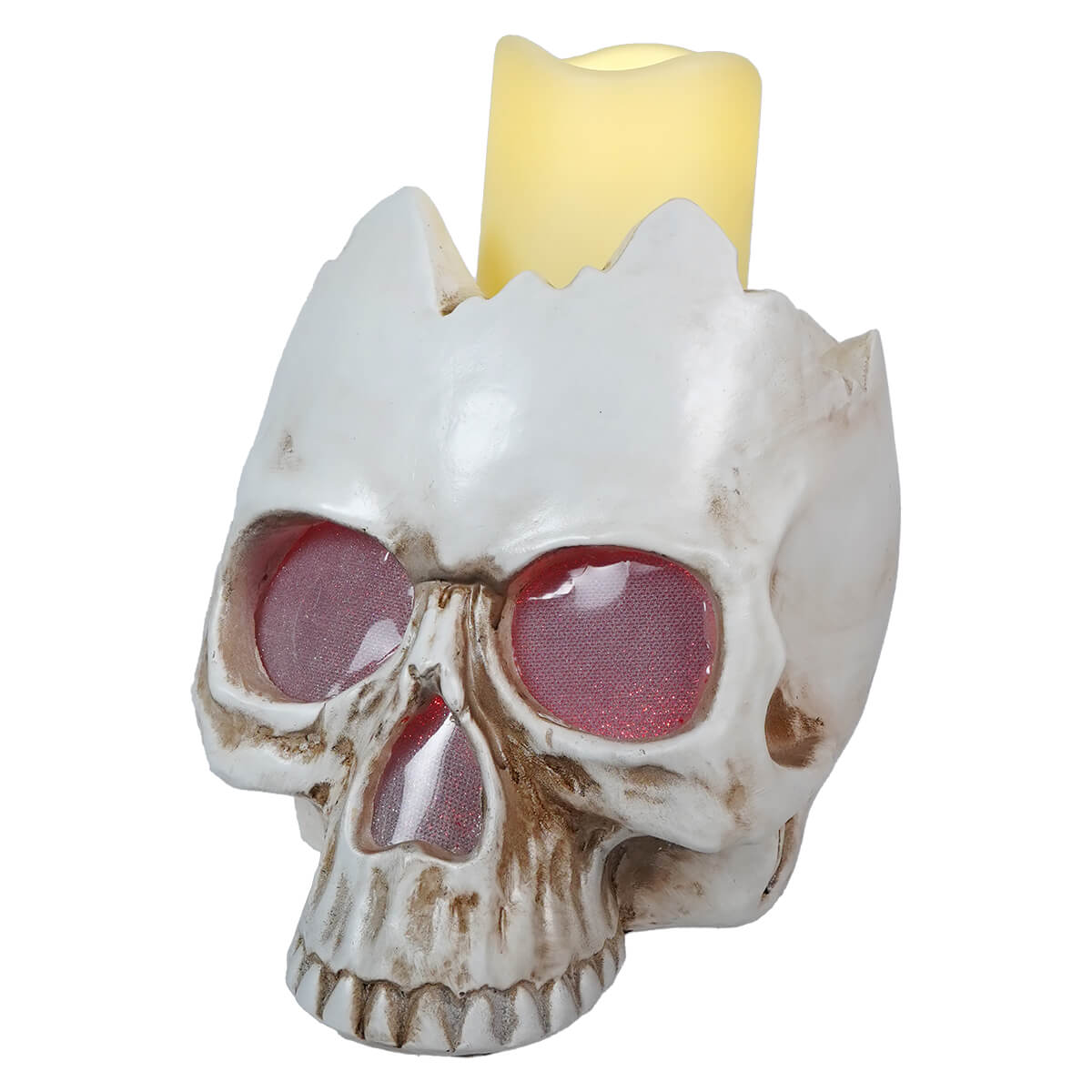 Skull-shaped candle holder with a lit yellow candle on top.