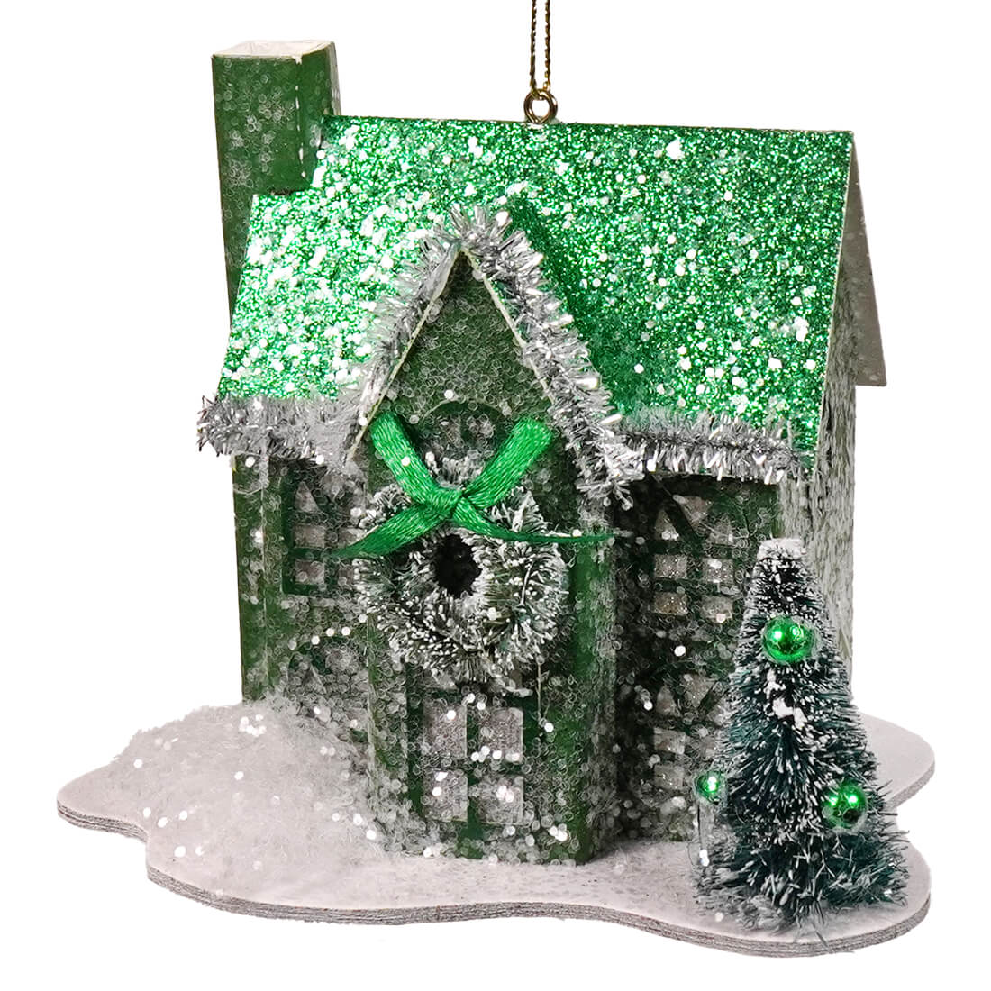 A festive green holiday lane house ornament with silver tinsel trim wreath and miniature flocked christmas tree in a lane house ornaments set