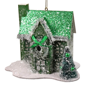 A festive green holiday lane house ornament with silver tinsel trim wreath and miniature flocked christmas tree in a lane house ornaments set
