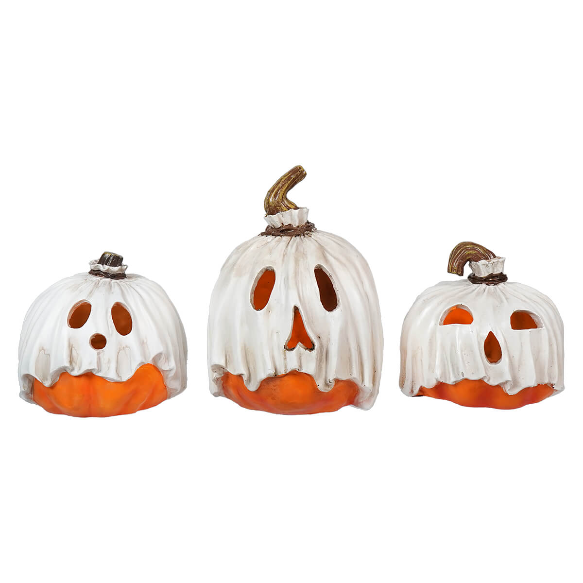 Three white ceramic pumpkins with orange bases and carved jack-o’-lantern faces.