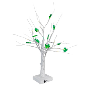 White artificial tree with green LED lights on its branches.