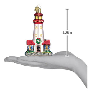 Festive red and white glass lighthouse ornament with gold accents and green wreath figural decor for tree toppers