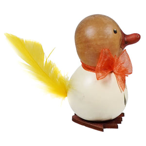 A lil dillard duck gourd with a light brown head white body orange bow and bright yellow feather tail by meadowbrooke gourds