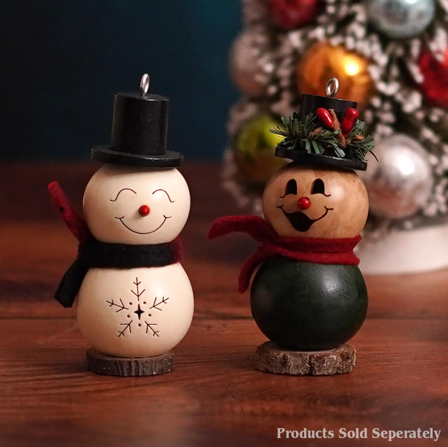 Two handcrafted wooden snowman gourd ornaments with black hat red scarf and wreath-adorned hat meadowbrooke large snowman