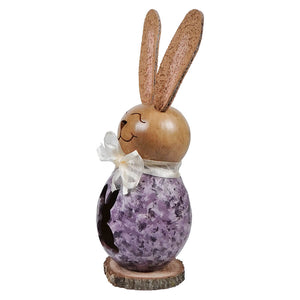 A lil willow purple bunny gourd figurine with a wooden easter bunny, textured ears, and a white ribbon bow on a wood base