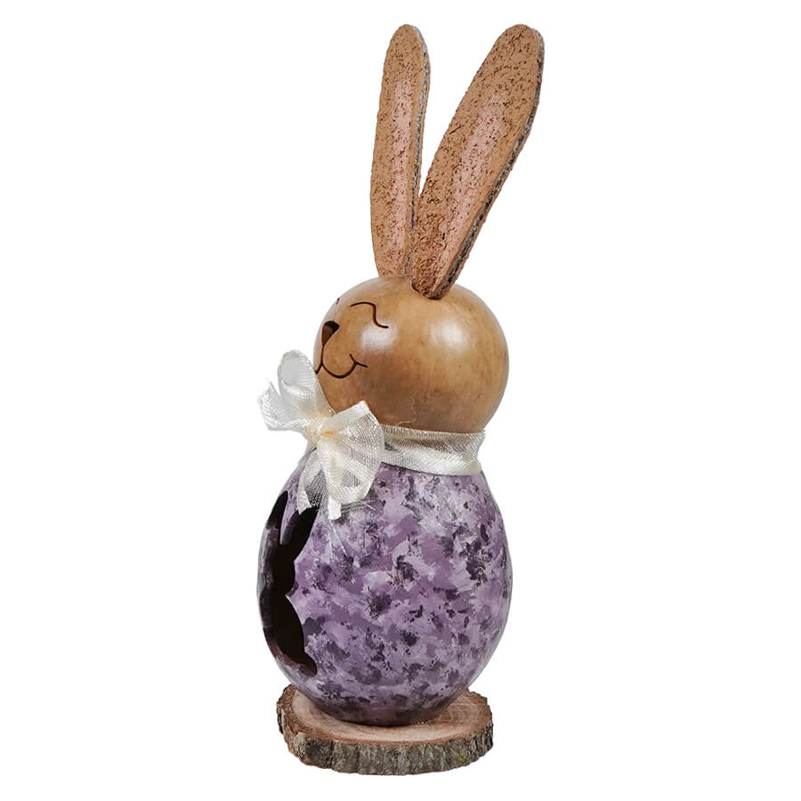 A lil willow purple bunny gourd figurine with a wooden easter bunny, textured ears, and a white ribbon bow on a wood base