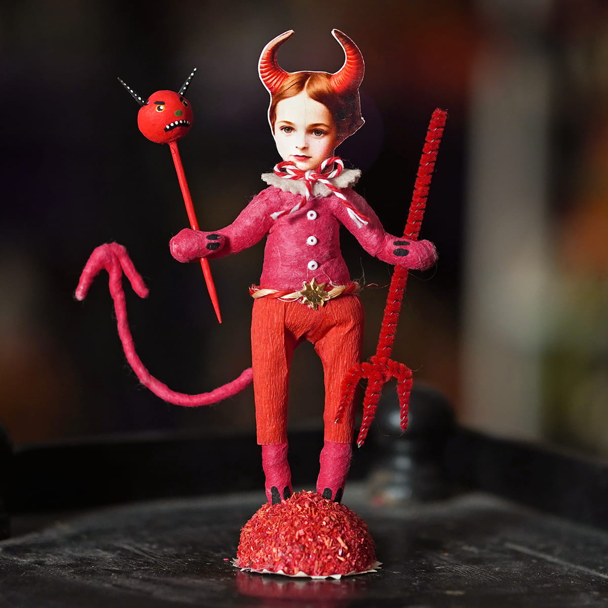 Little devil boy figure with whimsical red devil design handcrafted folk art paper mache and textured fabric outfit
