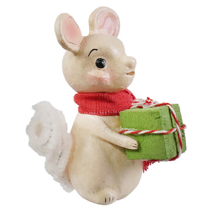 A cream-colored resin little mouse with a red burlap scarf holding a green gift box by bethany lowe designs