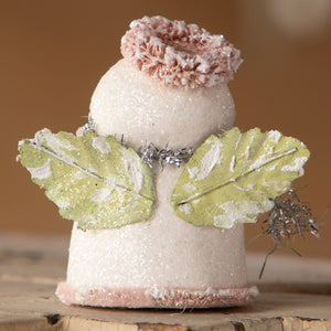A glittery white bethany lowe little snow angel figurine with pink frosted wings and green leaf accents perfect for decor