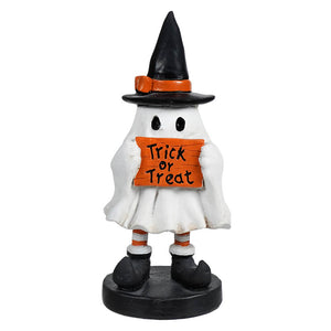 Little trick or treat ghost is a white treat ghost figurine wearing a black witch hat holding an orange halloween sign