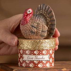 Little turkey on box resin figurine with red head and brown feathers perched on glittery gold plaid box thanksgiving decor