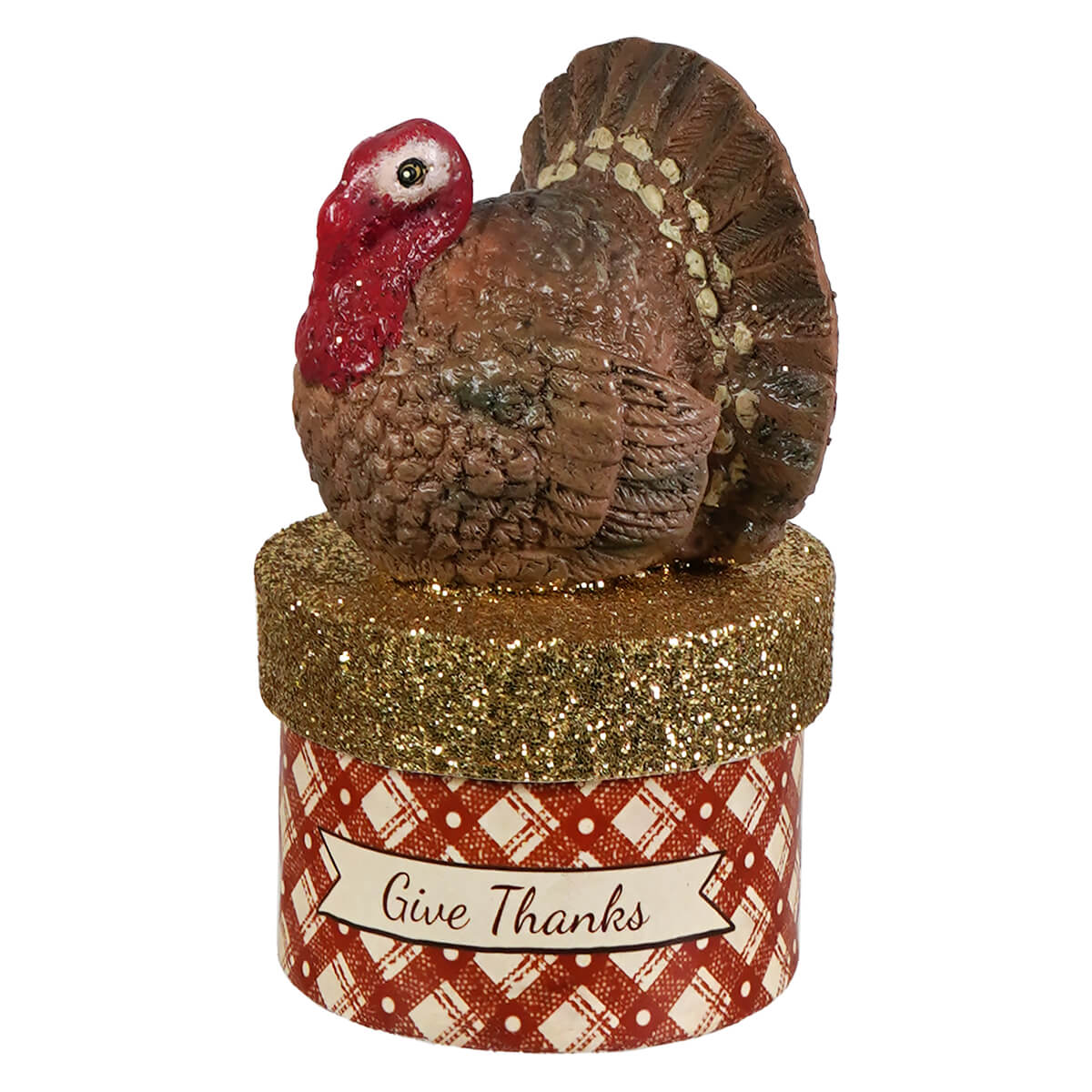 A brown ceramic turkey figurine with red wattle on a glittery gold lid of a red and cream plaid box for thanksgiving decor