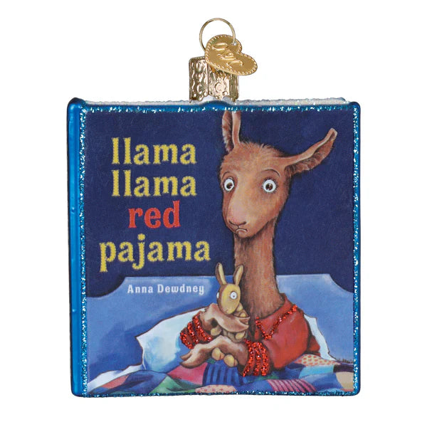 Blue glitter-edged glass llama llama red pajama book ornament with brown llama in red pajamas holding yellow bunny, perfect book club ornament and figural decor
