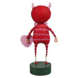 Love monster red textured folk art figurine with pink horns and striped limbs on green base spreading holiday cheer