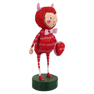 Love monster red devil figurine with pink horns and polka-dot bow wearing striped red fabric spreading holiday cheer folk art