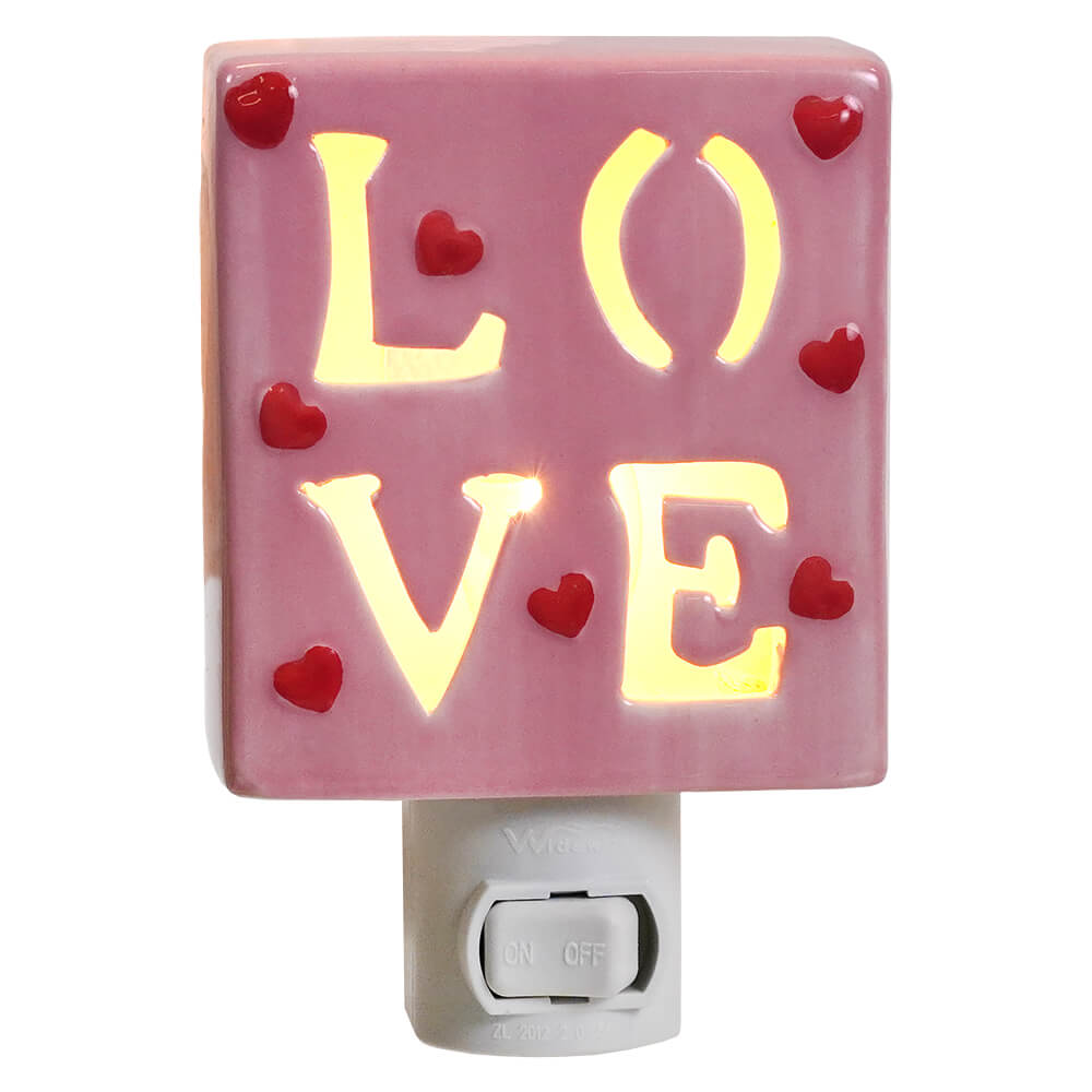 Pink ceramic valentine’s day night light glowing yellow love letters with red heart decorations for love vibe