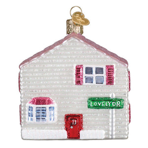 A charming white glass house ornament with pink shutters red door marked 13 and green lovelydr street sign perfect for norman rockwell house ornaments collection