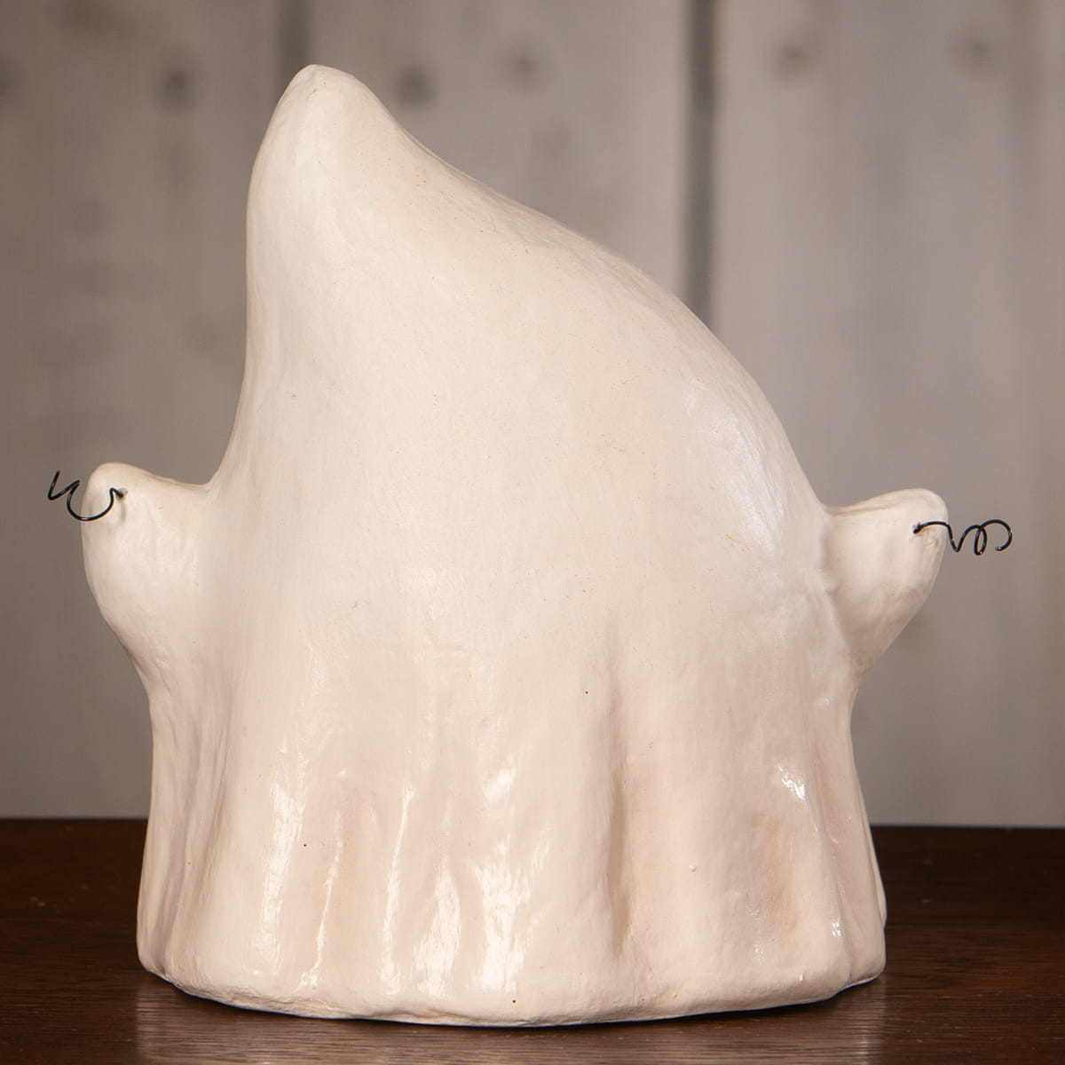 Cream-colored ceramic luminary ghost with smooth glossy finish and subtle ridges featuring boo with banner for halloween ghost figures decor and ornaments
