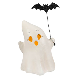 A white translucent ghost luminary boo with bat holding a black glitter bat with orange eyes and smiling face