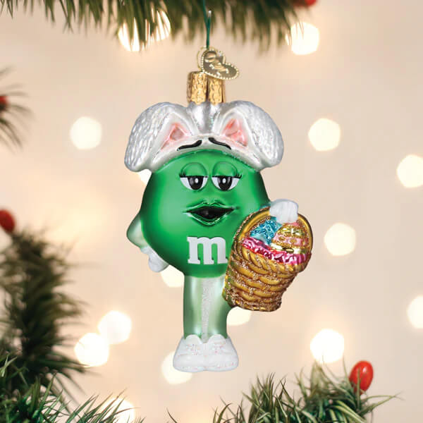 Green easter ornament featuring m&m’s green easter character with bunny ears holding a basket of easter eggs food & drink ornaments