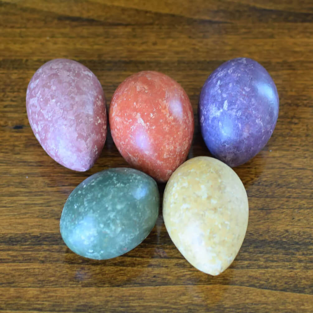 Five handcrafted speckled stone marbled gourd easter eggs in pastel pink terracotta red deep purple teal green and beige
