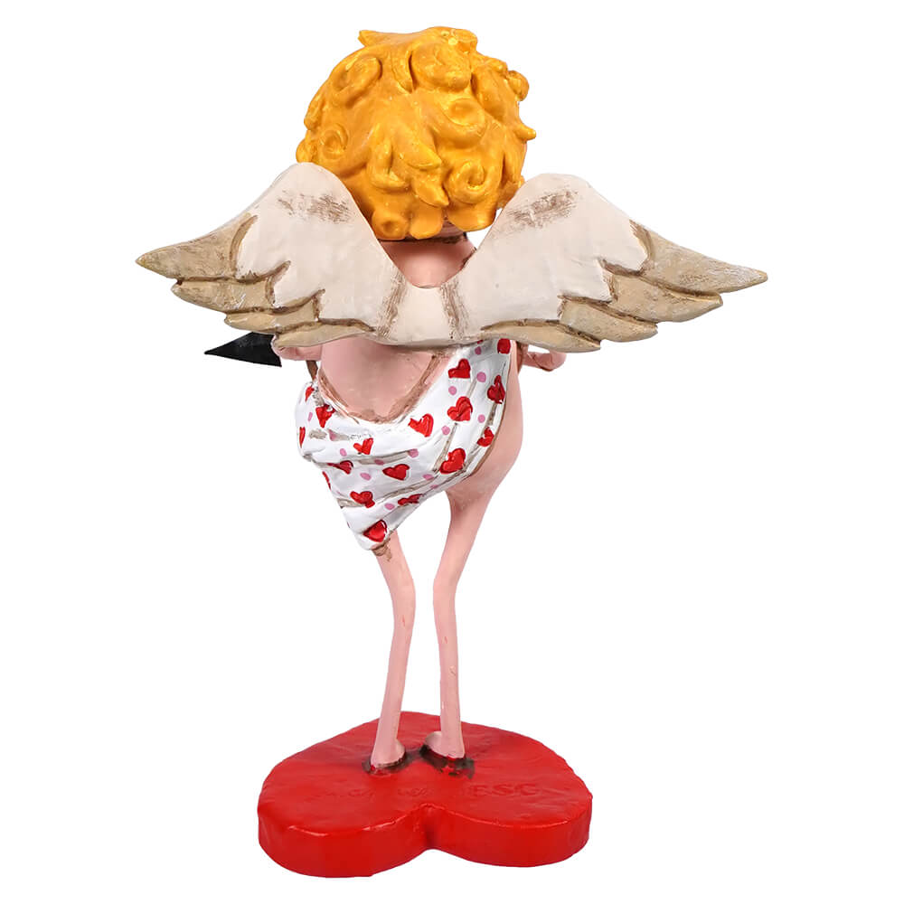 A whimsical angel figurine with curly yellow hair wearing a heart-patterned dress standing on a red heart base.