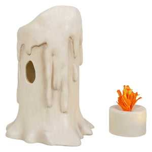 Cream-colored medium flam’in candle luminary with faux wax drips and hollow center holding an orange led tea light flame