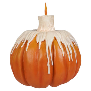 Orange melting midnight glow pumpkin candle holder with white wax drip effect and glowing orange flame on top