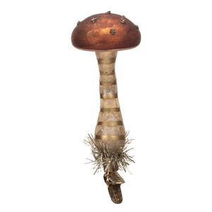 Decorative mushroom-shaped ornament with a reddish-brown cap and striped stem.