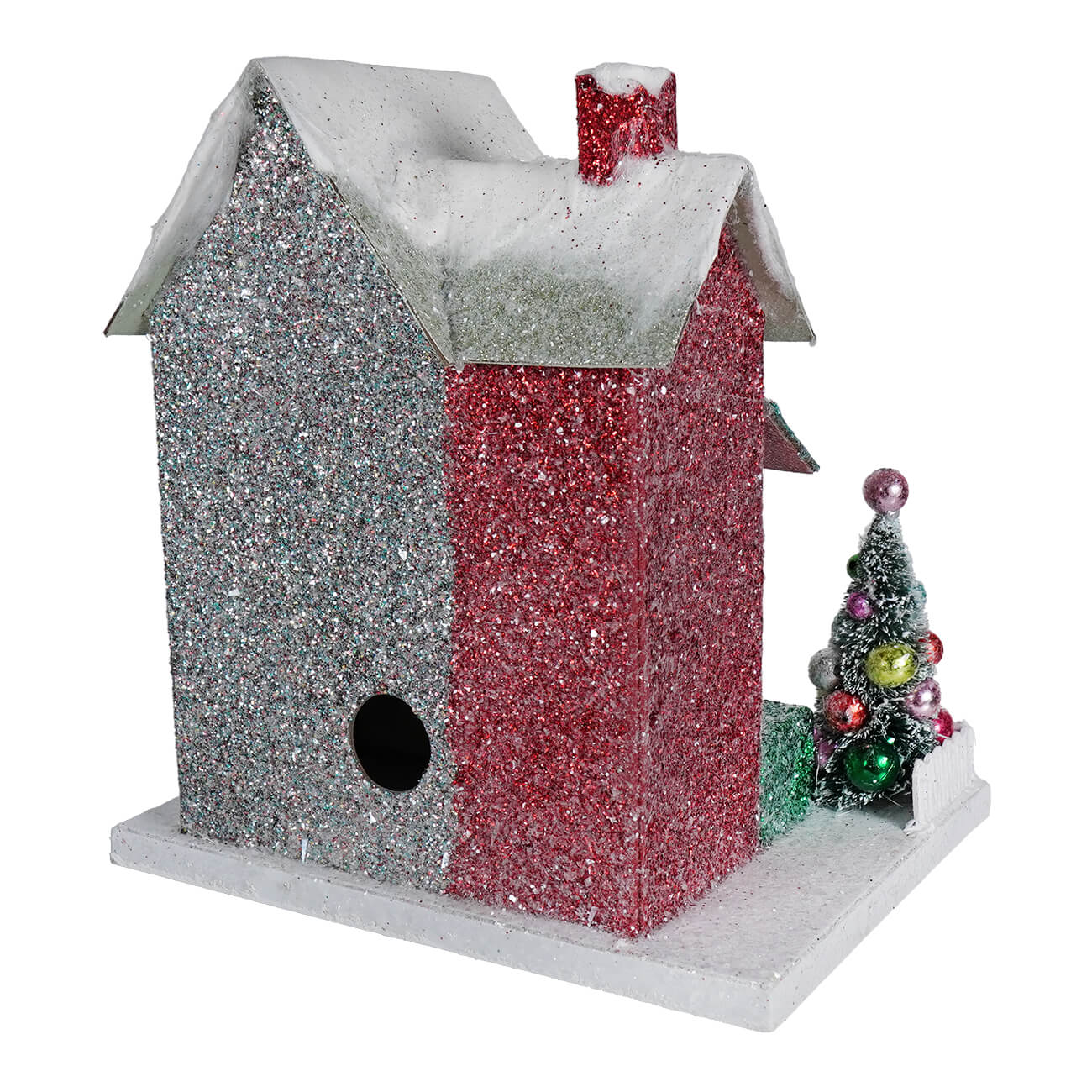 A merry bright glitter cottage birdhouse with red and silver sparkly exterior and snow-dusted roof with chimney