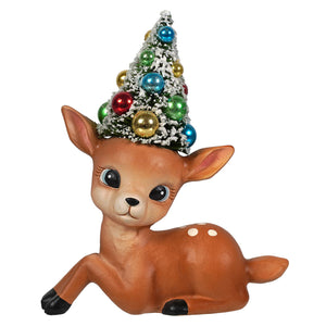 A charming brown ceramic deer figurine with white spots wearing a christmas tree hat by bethany lowe design