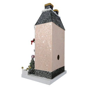 A festive merry manor glittered snowy pink birdhouse with a black roof and chimney by cody foster