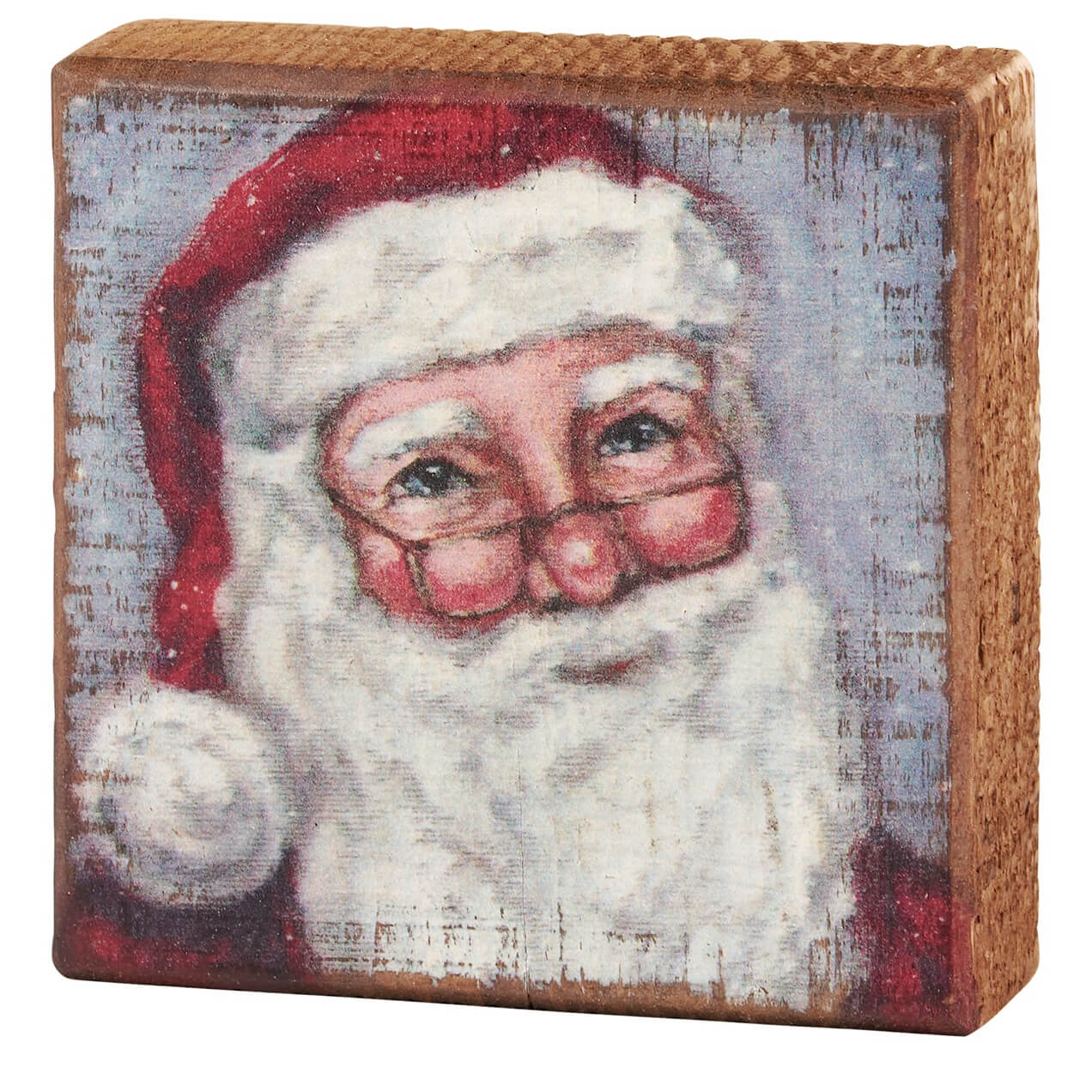 Wooden block with a painted portrait of Santa Claus.