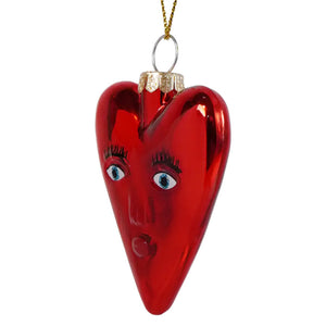 Mi amor heart glass ornament is a glossy red heart ornament with a painted face hanging from a gold chain perfect for valentine’s day