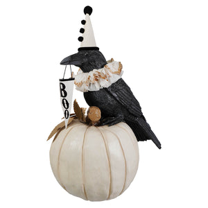 Black messenger crow figurine with white party hat and ruffled collar perched on off-white pumpkin by bethany lowe halloween