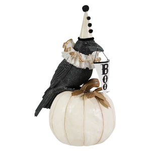 Black messenger crow figurine with white polka dot party hat on glossy pumpkin holding boo banner bethany lowe halloween