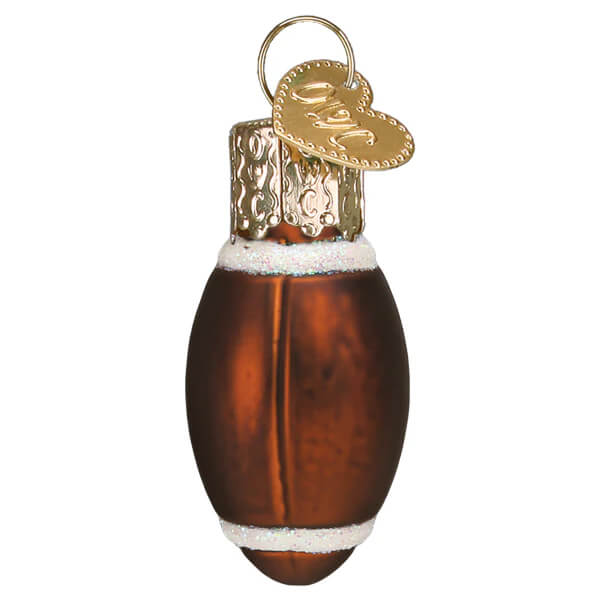 A glossy amber glass mini football ornament with white glittery stripes and a gold heart shaped tag perfect for world christmas ornaments