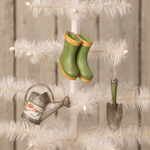 Green rubber boots with yellow trim mini garden ornaments hanging on white tree by bethany lowe designs spreading holiday cheer