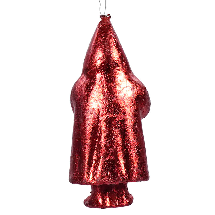 Red metallic Christmas tree ornament shaped like a stylized Santa Claus figure.