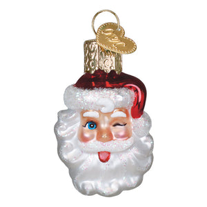 Mini winking santa ornament is a red and white christmas glass ornament with a glittery beard and a winking blue eye