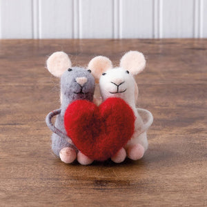 A charming gray and white needle-felted mouse couple critter holding a red felt heart ornament