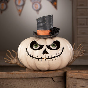 Mr gourdy pumpkin is a white halloween pumpkin with a spooky skull face green eyes and a top hat with orange band