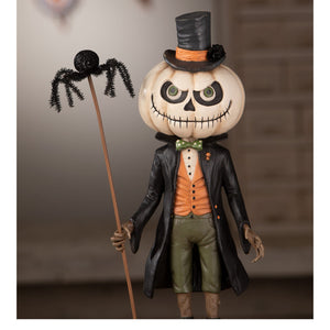A whimsical halloween figural decor of mr gourdy with a white pumpkin head, green eyes, orange vest, and black coat