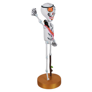 White kook skeleton pirate figurine with colorful day of the dead makeup black bird and orange ribbon halloween decorations