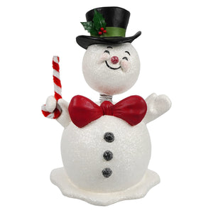 A cheerful white glittery mr jolly bobble head snowman figurine by bethany lowe design holding a candy cane